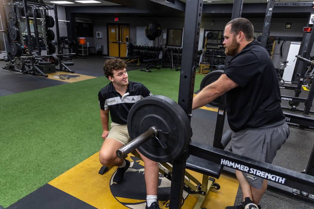 Jackson Buck with strength and conditioning coach